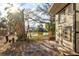 Scenic lake view from the property with mature trees, lush greenery and a storage shed at 4710 Gleason Ave, Sarasota, FL 34242