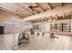 Large living area featuring white wood ceilings, tile floors, and abundant natural light from the surrounding windows at 4710 Gleason Ave, Sarasota, FL 34242