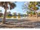Picturesque water view showcasing waterfront homes, palm trees, and clear blue skies at 4710 Gleason Ave, Sarasota, FL 34242