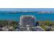 Stunning aerial view of the condo building on the water with city skyline views at 500 N Osceola Ave # 203, Clearwater, FL 33755