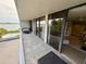 Exterior balcony with a view of a pool, water, and nearby city at 500 N Osceola Ave # 203, Clearwater, FL 33755