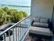 Cozy balcony with outdoor seating and beautiful views of the water at 500 N Osceola Ave # 203, Clearwater, FL 33755