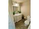 Bathroom with tiled floors, white cabinets, and decor at 500 N Osceola Ave # 203, Clearwater, FL 33755