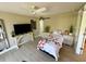 Light and airy bedroom features a ceiling fan and a barn door at 500 N Osceola Ave # 203, Clearwater, FL 33755