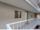 Exterior of a residential building featuring a secure entrance, and well-maintained outdoor areas at 500 N Osceola Ave # 203, Clearwater, FL 33755