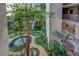 Relaxing courtyard with lush landscaping, water feature, and access to the condo at 500 N Osceola Ave # 203, Clearwater, FL 33755