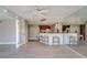 Open dining and kitchen area with a breakfast bar and barstool seating at 500 N Osceola Ave # 203, Clearwater, FL 33755
