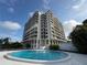 Striking exterior view of the condo complex and refreshing pool area, perfect for relaxation at 500 N Osceola Ave # 203, Clearwater, FL 33755