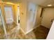 Hallway leading to other rooms, coat hooks on the wall and flooring tiles at 500 N Osceola Ave # 203, Clearwater, FL 33755