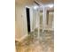 Hallway with tile floors and mirrored closet doors leading to the bedrooms at 500 N Osceola Ave # 203, Clearwater, FL 33755