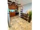 The eat-in kitchen features wooden cabinets, stainless appliances, and a bar for seating at 500 N Osceola Ave # 203, Clearwater, FL 33755