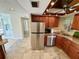 Beautiful open kitchen featuring stainless steel appliances, granite countertops and wood cabinetry at 500 N Osceola Ave # 203, Clearwater, FL 33755
