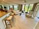 This well-lit living area provides a cozy couch, patterned chair, and breakfast bar at 500 N Osceola Ave # 203, Clearwater, FL 33755