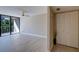 Bright living room featuring a ceiling fan, and sliding glass doors providing access to the balcony at 500 N Osceola Ave # 203, Clearwater, FL 33755