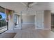 Open-concept living area with access to a spacious balcony overlooking serene waters and natural beauty at 500 N Osceola Ave # 203, Clearwater, FL 33755