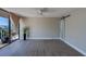 Bright living room with a ceiling fan, sliding glass doors that let in natural light and access to a balcony at 500 N Osceola Ave # 203, Clearwater, FL 33755