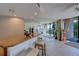 Bright and airy living room with a bar and access to an outdoor balcony at 500 N Osceola Ave # 203, Clearwater, FL 33755