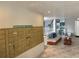 Hallway and lobby area with couches, shell decorations, and package drop off at 500 N Osceola Ave # 203, Clearwater, FL 33755