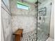 Bathroom featuring a glass enclosed shower with marble and pebble flooring at 5714 Garden Lakes Fern, Bradenton, FL 34203