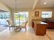 Sun-filled dining area with views of the lanai and backyard, adjacent to the kitchen at 5714 Garden Lakes Fern, Bradenton, FL 34203