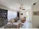 Cozy home office with natural light, ceiling fan, and ample storage with a bookshelf at 5714 Garden Lakes Fern, Bradenton, FL 34203