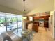 Eat-in kitchen with breakfast nook, tile floor, and a view of the backyard at 5714 Garden Lakes Fern, Bradenton, FL 34203