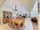 Open-concept living room and dining room with tile flooring and plenty of natural light at 5714 Garden Lakes Fern, Bradenton, FL 34203