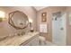 Bathroom featuring a decorative mirror, vanity, and shower stall at 6114 Misty Oaks St, Sarasota, FL 34243