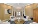 Elegant foyer showcasing tile floors, white columns, and views into the living spaces and dining room at 6114 Misty Oaks St, Sarasota, FL 34243