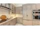 Stylish kitchen features sleek appliances, ample cabinet space, and modern finishes at 6114 Misty Oaks St, Sarasota, FL 34243