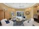 Bright and airy living room with a large window overlooking the screened-in pool and patio area at 6114 Misty Oaks St, Sarasota, FL 34243