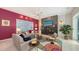Cozy living room with elegant fireplace, comfortable seating, and bright accents at 6114 Misty Oaks St, Sarasota, FL 34243
