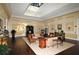 Spacious lobby area featuring hardwood floors, skylight, and elegant furnishings at 6114 Misty Oaks St, Sarasota, FL 34243
