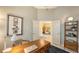 Bright home office with French doors offering an airy feel with a stylish desk and comfortable seating at 6114 Misty Oaks St, Sarasota, FL 34243