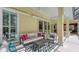 Covered outdoor patio with a cozy seating area at 6114 Misty Oaks St, Sarasota, FL 34243