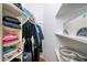 Organized walk-in closet featuring shelves, clothing racks, and ample storage space for clothes and accessories at 6114 Misty Oaks St, Sarasota, FL 34243