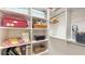 Organized walk-in closet with ample shelving and storage space for clothes and accessories at 6114 Misty Oaks St, Sarasota, FL 34243
