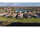 An aerial view of lakeside single-Gathering homes with screened-in patios in a tranquil, Primary-planned community at 6560 Willowshire Way, Bradenton, FL 34212