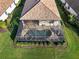Aerial view of the property featuring a screened-in pool, spa, and lush green landscaping at 6560 Willowshire Way, Bradenton, FL 34212