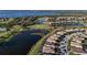 Beautiful aerial shot of a residential community with lakeside homes next to golf course and tropical greenery at 6560 Willowshire Way, Bradenton, FL 34212