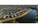 Beautiful aerial view of a waterfront community with lush landscaping and well-maintained homes along a scenic waterway at 6560 Willowshire Way, Bradenton, FL 34212