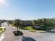 Community entrance to The Sanctuary featuring lush landscaping and meticulously maintained streets at 6560 Willowshire Way, Bradenton, FL 34212