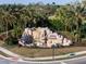 Scenic entrance to River Strand featuring a decorative rock waterfall and lush greenery at 6560 Willowshire Way, Bradenton, FL 34212