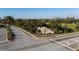 Community entrance to River Strand featuring a decorative rock waterfall and lush greenery at 6560 Willowshire Way, Bradenton, FL 34212