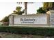 Community sign to The Sanctuary at River Strand featuring a decorative rock waterfall and greenery at 6560 Willowshire Way, Bradenton, FL 34212