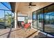 Covered brick patio with outdoor seating and screened enclosure; overlooks backyard and landscaping at 6560 Willowshire Way, Bradenton, FL 34212