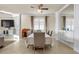 Elegant dining room featuring neutral tones and large windows for natural light at 6560 Willowshire Way, Bradenton, FL 34212
