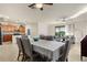 Open layout with a large table surrounded by living spaces, with view of backyard at 6560 Willowshire Way, Bradenton, FL 34212