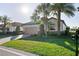 Beautiful home with tile roof, brick driveway, two-car garage and lush landscaping at 6560 Willowshire Way, Bradenton, FL 34212