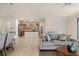 Open floor plan showcasing the living room and the kitchen with an island and stainless steel appliances at 6560 Willowshire Way, Bradenton, FL 34212